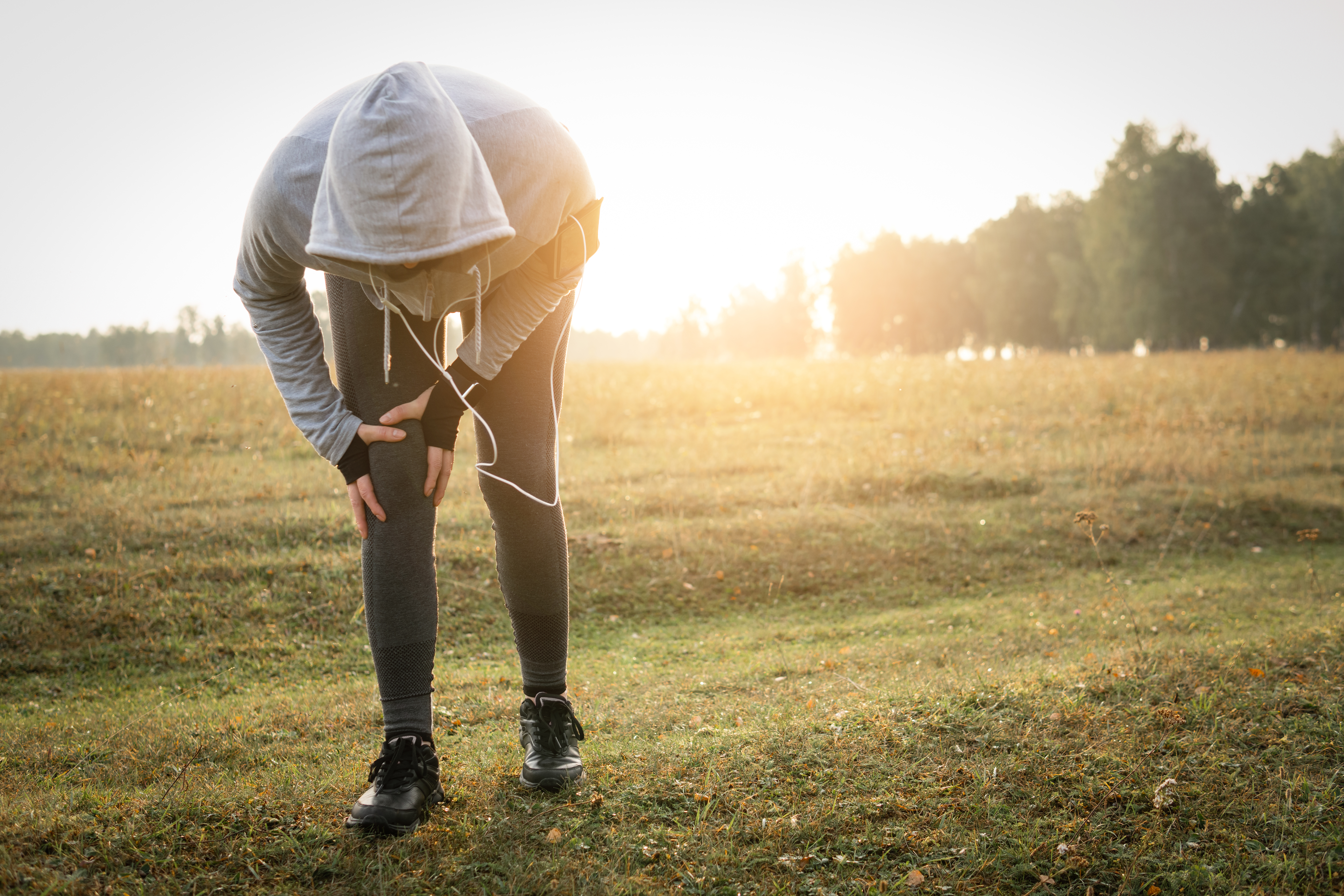 Injuries - sports running knee injury on woman