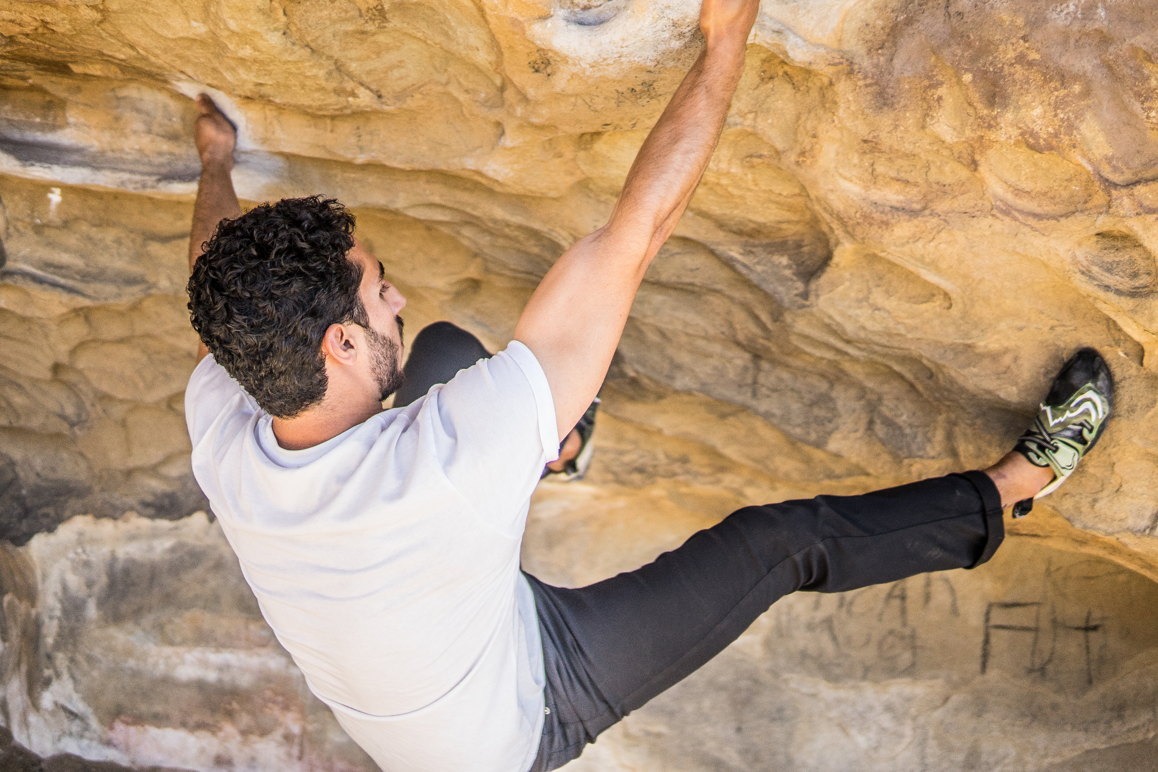 Canva - Man Rock Climbing